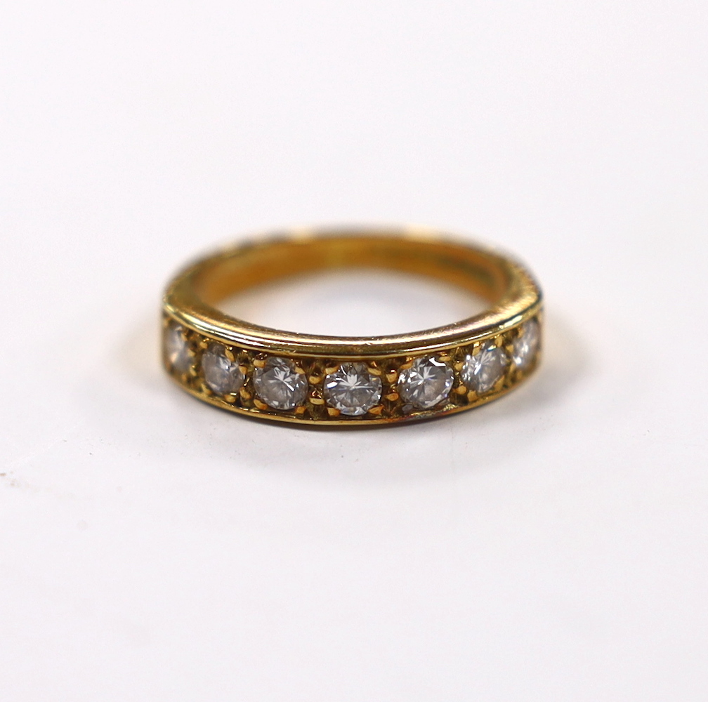A modern 18ct gold and seven stone diamond set half hoop ring, size L, gross weight 4.3 grams. Fair condition.
